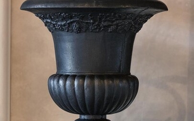A cast iron garden urn