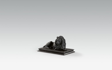 A cast iron lion paperweight
