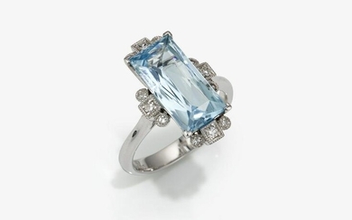 A cocktail ring decorated with aquamarine and brilliant