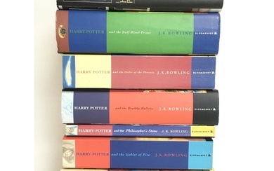 A collection of Harry Potter books including four first edit...