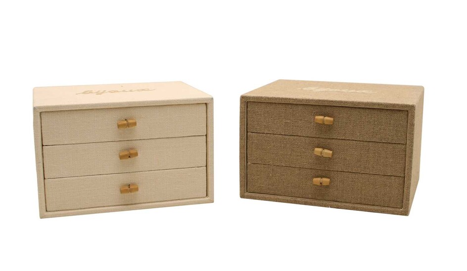 A cream linen covered three drawer 'Bijoux' jewellery box with wood toggle handles