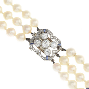 A cultured pearl three-row necklace, with mid 20th century platinum and gold, diamond and sapphire clasp.