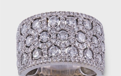 A diamond and fourteen karat white gold ring designed...