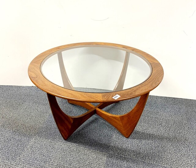 A glass topped G-plan circular coffee table, Dia. 83cm. H. 46cm.
