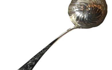 A good large provincial Irish George III soup ladle with rop...