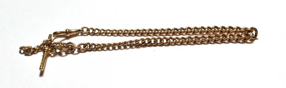A graduated curb link watch chain, each link stamped '9'...