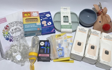 A group of baby items including bottles, silicon plates etc.