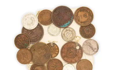 A group of twenty-two Chinese and Japanese coins 19th - 20th century...