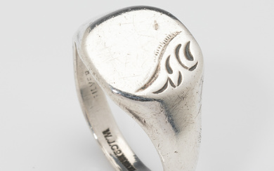 A large English hallmarked sterling silver hand engraved signet ring,...