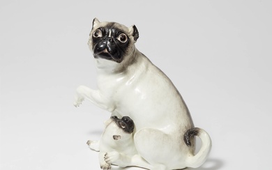 A large Meissen porcelain model of a pug dog and pup