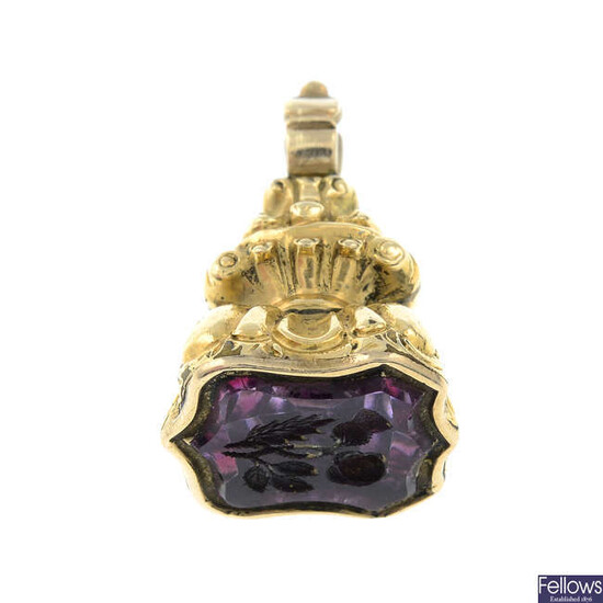 A late 19th century amethyst intaglio fob seal, depicting an entwined thistle and rose.