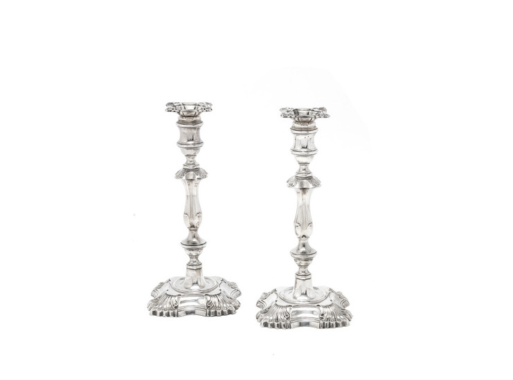 A matched pair of large silver candlesticks
