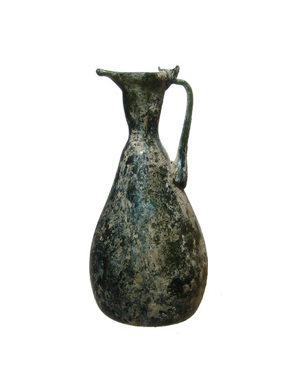 A nice Roman olive-green glass pitcher
