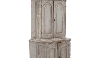 A painted Swedish Baroque cupboard, arched top, panneled doors behind which shelves...