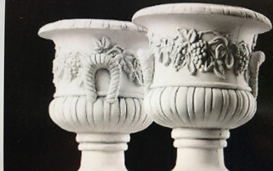 A pair of 20th-21st century large composite garden vases, cast with grapevine. H. 50 cm. Diam. 45 cm. (2)
