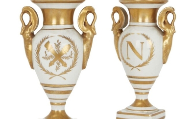 A pair of Capodimonte Empire style porcelain vases, mid to late 19th century, with twin gilt swan neck handles, with initial N within gilt laurel cartouches to obverse of bodies and crossed torcheres within gilt laurel cartouche to reverse, on...