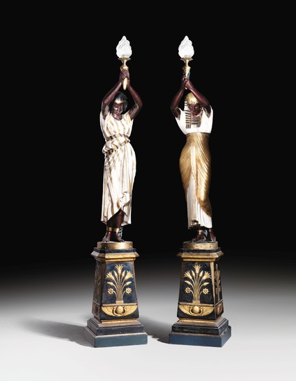 A pair of French parcel-gilt painted cast-iron figural torcheres after models by Mathurin Moreau from the Val d'Osne manufacture, late 19th/early 20th century