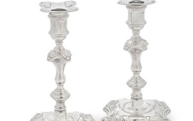 A pair of George II cast silver candlesticks William Gould,...