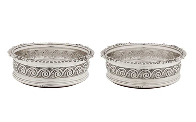 A pair of George III sterling silver wine coasters, London 1812 by Solomon Hougham