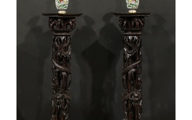 A pair of Indo-Chinese entrance hall torchères or statuary p...