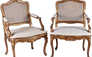 A pair of Louis XV style carved giltwood caned...