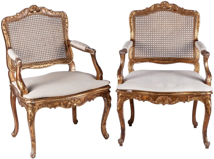 A pair of Louis XV style carved giltwood caned...