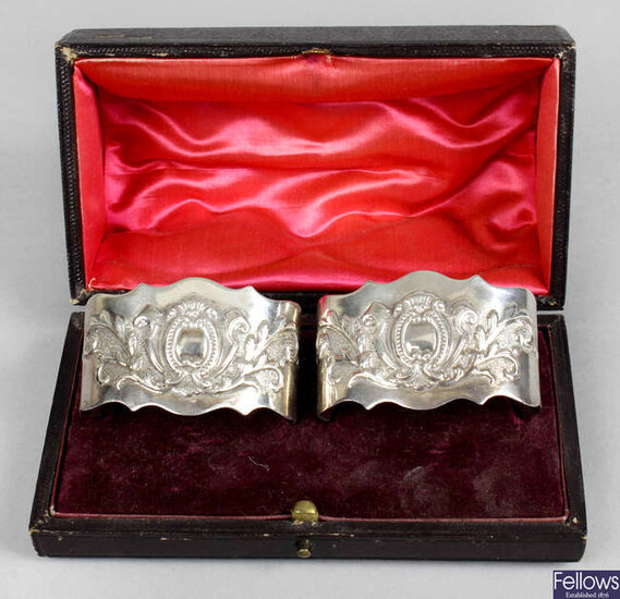A pair of Victorian silver napkin rings, in fitted case.