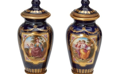 A pair of diminutive SEvres-style porcelain urns