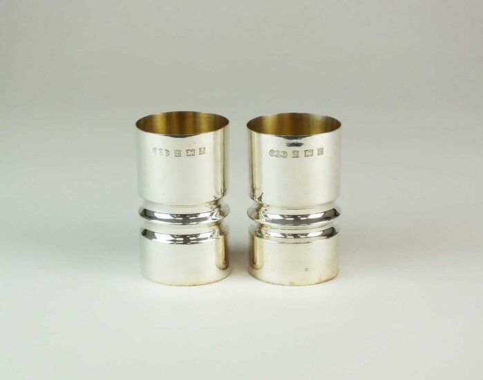 A pair of modern silver beakers
