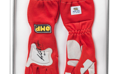 A pair of official OMP Gloves signed by Michael Schumacher...
