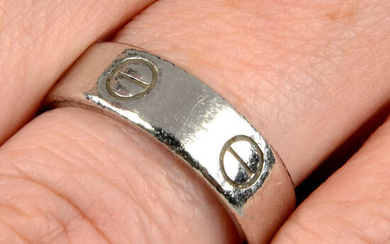 A platinum 'Love' ring, by Cartier.