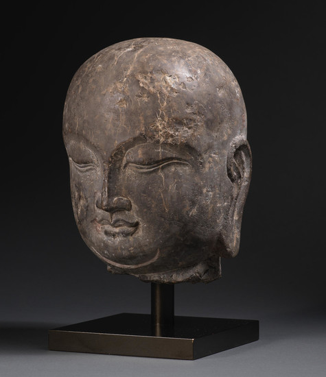 A rare carved black limestone head of a luohan