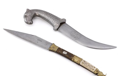A recent Indian silver decorated camel headed dagger with grip and scabbard...