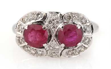 A ruby and diamond ring set with two circular-cut rubies weighing a...