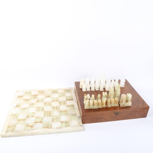 A set of green and white onyx chessmen, with matching onyx c...