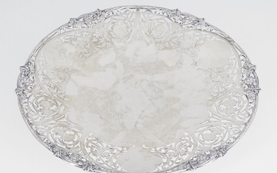 A shallow silver dish with pierced rim, Sheffield, c.1961, S J Rose & Son, of circular form, the scrolling foliate pierced sides to shaped rim with fruiting vine decoration, 26.5cm dia., approx. weight 19.8oz