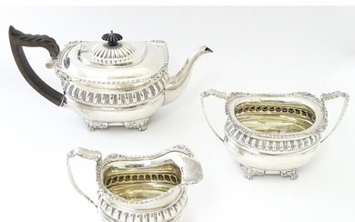 A three piece silver tea set comprising teapot, milk jug, an...
