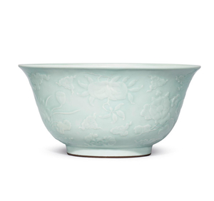 A very rare large celadon-glazed carved and moulded 'flowers and fruit' bowl