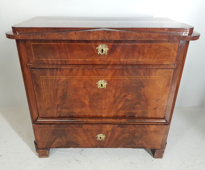 A walnut veneer chest of drawers with three drawers and...