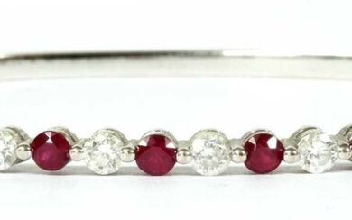A white gold ruby and diamond hinged bangle