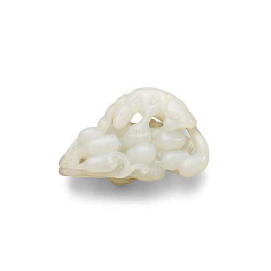 A white jade carving of a squirrel on grapes