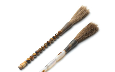 AN AGATE BRUSH HANDLE AND A TIGER'S EYE BRUSH HANDLE...