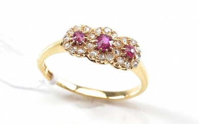 AN ANTIQUE TRIPLE CLUSTER RUBY AND ROSE CUT DIAMOND RING IN 18CT GOLD, RING SIZE L, 2.5GMS