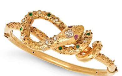 AN ANTIQUE VICTORIAN DIAMOND, RUBY, PEARL AND EMERALD SNAKE BANGLE in 18ct yellow gold, the bangle