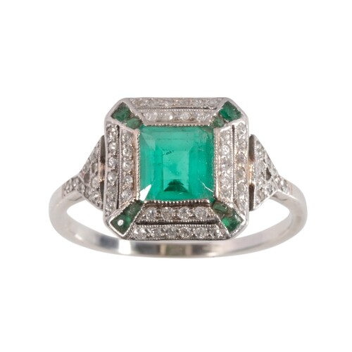 AN ART DECO EMERALD AND DIAMOND CLUSTER RING the emerald 5mm...