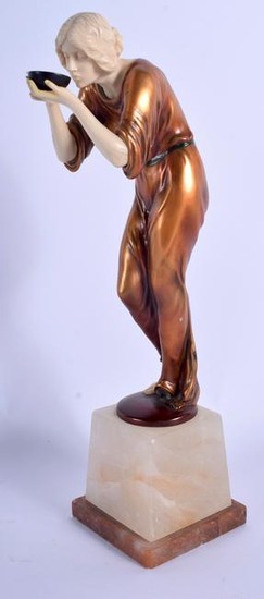 AN ART DECO STYLE IVORINE COLD PAINTED SPELTER FIGURE