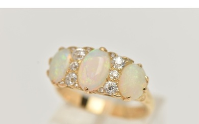 AN EARLY 20TH CENTURY OPAL AND DIAMOND RING, set with gradua...