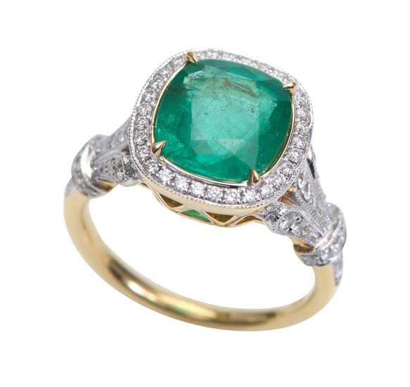 AN EMERALD AND DIAMOND RING-Featuring a cushion cut emerald weighing 3.09cts, with diamonds set to the surround and shoulders totall...
