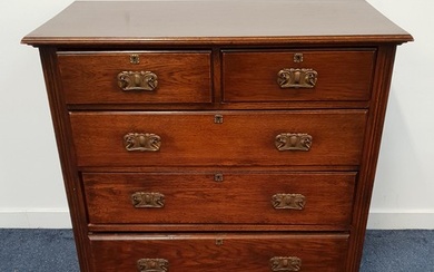 ARTS AND CRAFTS OAK CHEST OF DRAWERS with a moulded top abov...