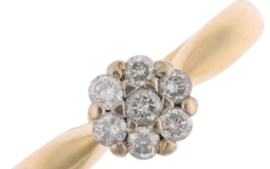 An 18ct gold diamond flowerhead cluster ring, set with moder...